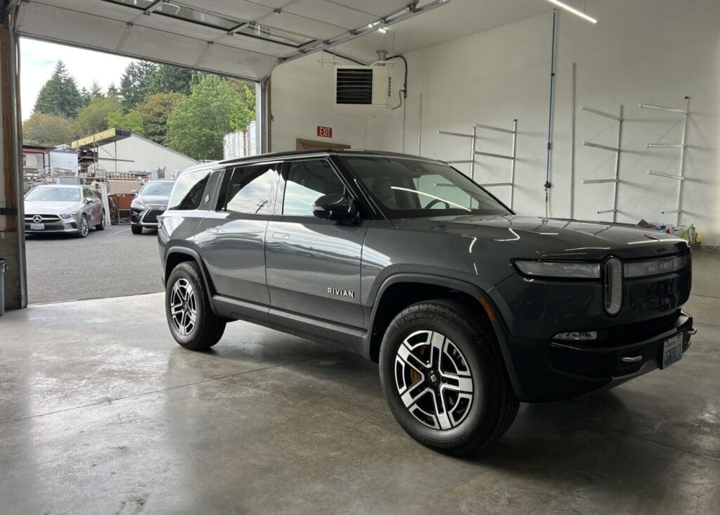 Rivian SUV parked in garage